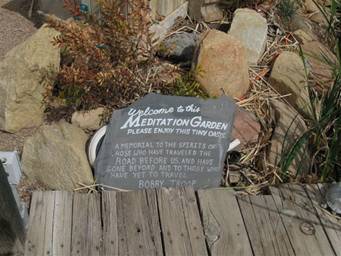 #18 Plaque at fishpond at store.JPG